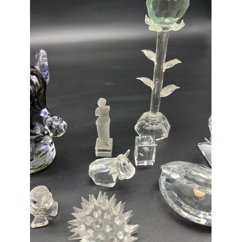 222 - A Quantity of crystal and art glass animals to include various Swarovski crystal figures.