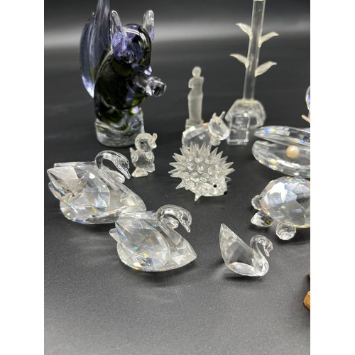 222 - A Quantity of crystal and art glass animals to include various Swarovski crystal figures.