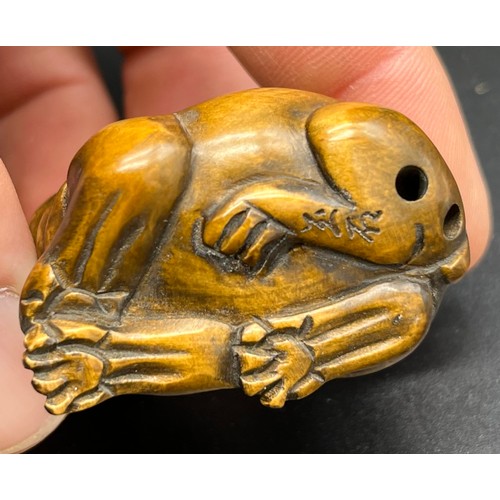 249 - Hand carved Japanese Netsuke sculpture of a hippo resting with a snake on its back. Signed and fitte... 