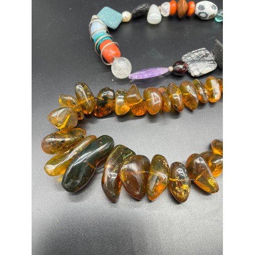 257 - Antique/ Vintage Unique raw amber bead necklace. Beads vary in sizes. Fitted with a white metal clas... 