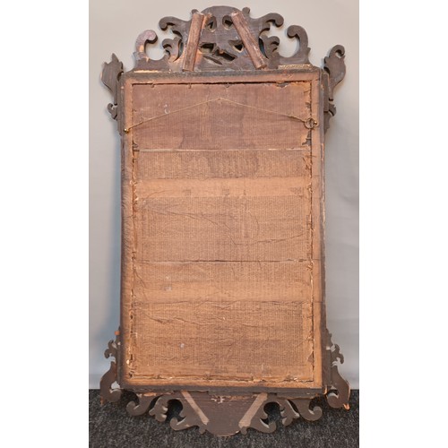 388 - Georgian carved scroll framed mirror with central gilt painted moulded bird [85x50cm]