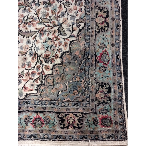 403 - A Wool Rug with Floral design. L 270 X W 148