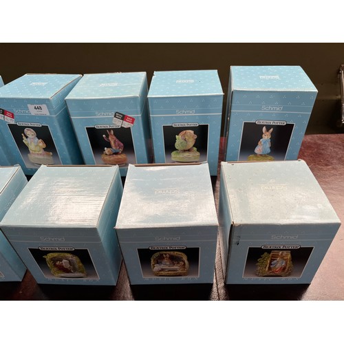 448 - A Collection of 10 boxed porcelain Schmid Beatrix potter Peter Rabbit character music boxes.