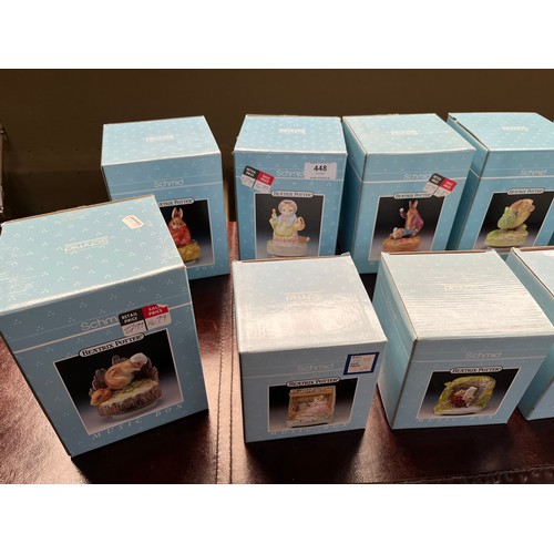 448 - A Collection of 10 boxed porcelain Schmid Beatrix potter Peter Rabbit character music boxes.