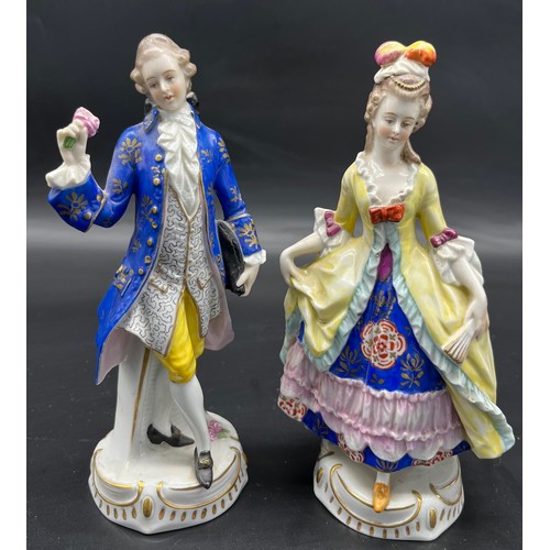 412 - Two 19th century Chelsea pottery gentleman and lady figurine. [19cm high]