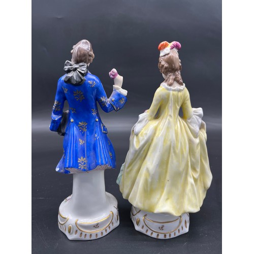 412 - Two 19th century Chelsea pottery gentleman and lady figurine. [19cm high]