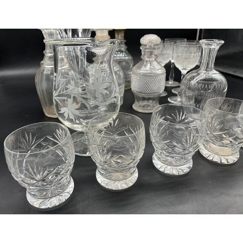 298 - A Collection of crystal decanters and glasses includes silver top decanter, Edinburgh crystal wine g... 