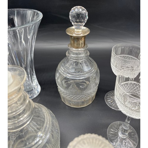 298 - A Collection of crystal decanters and glasses includes silver top decanter, Edinburgh crystal wine g... 