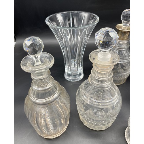 298 - A Collection of crystal decanters and glasses includes silver top decanter, Edinburgh crystal wine g... 