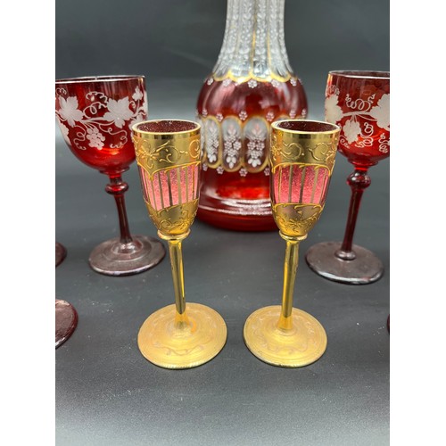 297 - A Lot of 19th century etched ruby glass wine glasses, cranberry etched glass, two ruby and gold pain... 