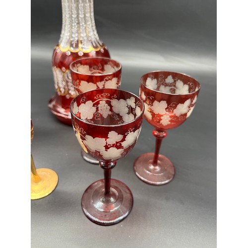 297 - A Lot of 19th century etched ruby glass wine glasses, cranberry etched glass, two ruby and gold pain... 