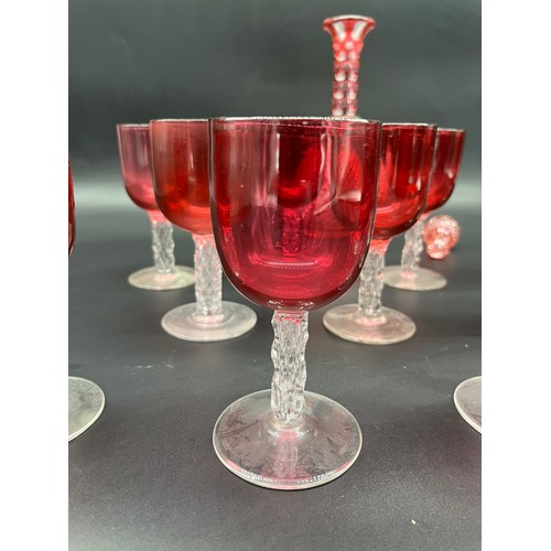 296 - A Collection of 11 Antique cranberry glass and facet cut stem wine glasses, together with cranberry ... 