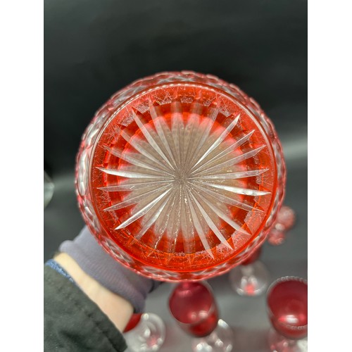 296 - A Collection of 11 Antique cranberry glass and facet cut stem wine glasses, together with cranberry ... 