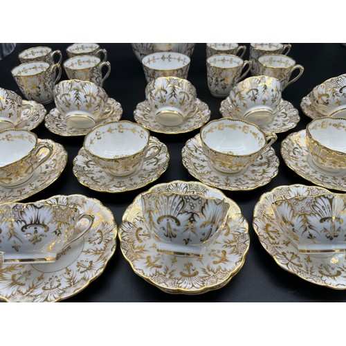 293 - A 35 Piece Victorian English Tea/ coffee set. Highly detailed gold trims and design.