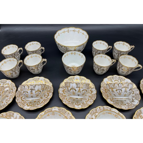 293 - A 35 Piece Victorian English Tea/ coffee set. Highly detailed gold trims and design.