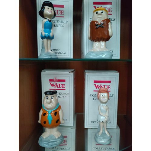 150 - 3 Shelves of limited edition Wade figures includes the Flintstones characters Fred , Wilma , barney ... 