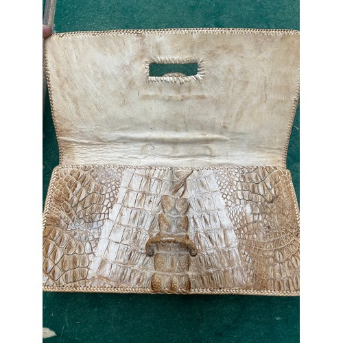 171 - A 1970s Crocodile skin clutch bag.