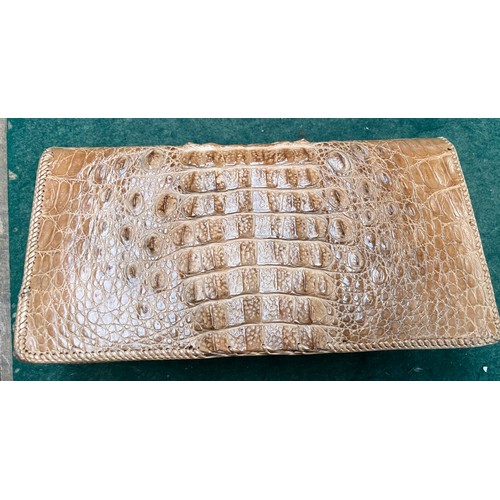 171 - A 1970s Crocodile skin clutch bag.