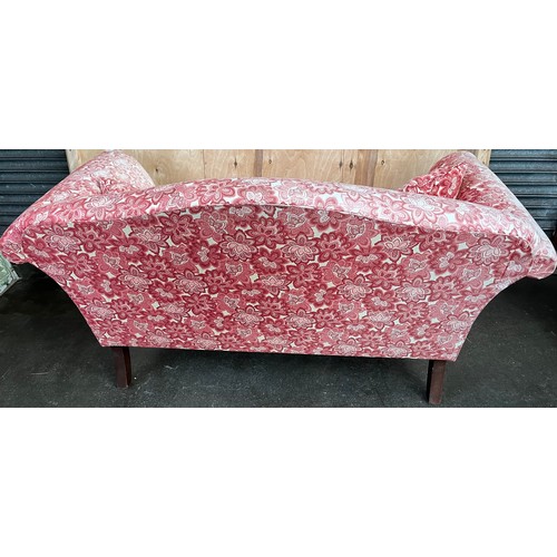 197 - Two seat sofa with scroll arms, red material upholstery, turned legs on brass castors [89x168x95cm]