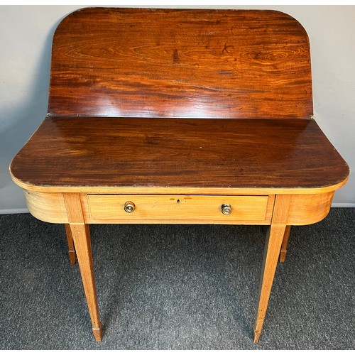 196A - 19th century mahogany flip top table, the D-shaped top opening to a larger surface area, above an in... 