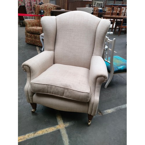 219 - Vintage arm chair with brass caster feet