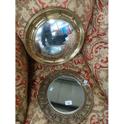 162 - 2 Brass framed circular mirrors. Arts and crafts and convex mirrors.