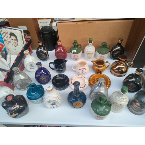 242 - Collection of whisky decanters and pub jugs etc