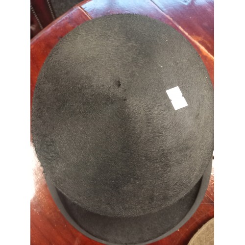 233 - A Lot of antique and vintage hats to include top hat by Superior Finish, Bowler hat by Moores London... 