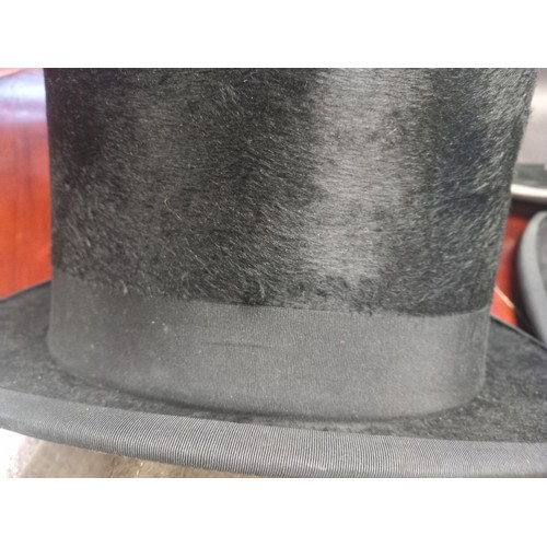 233 - A Lot of antique and vintage hats to include top hat by Superior Finish, Bowler hat by Moores London... 