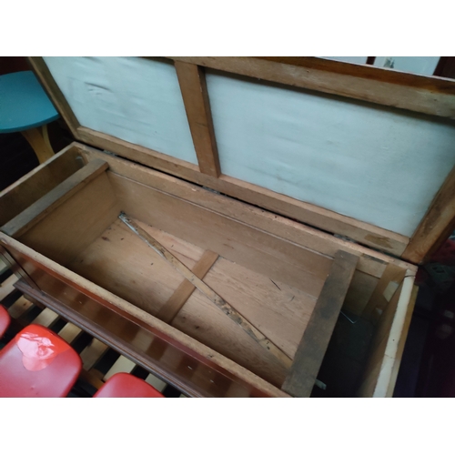 325 - Antique storage trunk with padded material top.