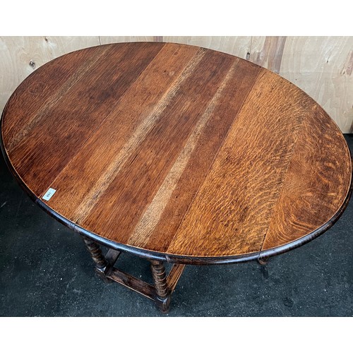 400 - Antique oak drop end dining table, designed with barley twist legs. [72x120x90cm]