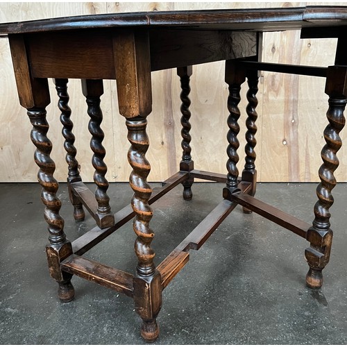 400 - Antique oak drop end dining table, designed with barley twist legs. [72x120x90cm]