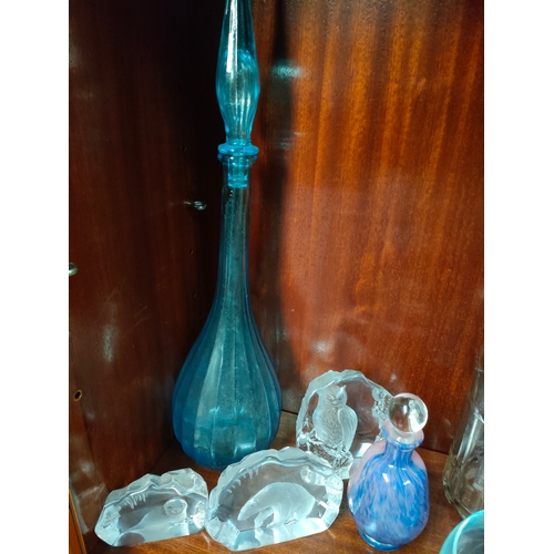 73 - Shelf of art glass ware to include large genie bottle, art glass sculpture vase, Caithness bowl and ... 