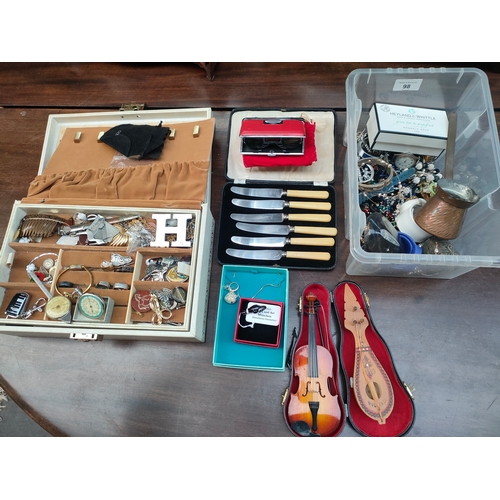 98 - 2 boxes of jewellery, 2 small ornamental musical instruments etc