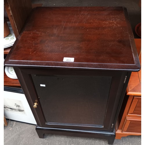 411 - Stag cupboard with glass panel door