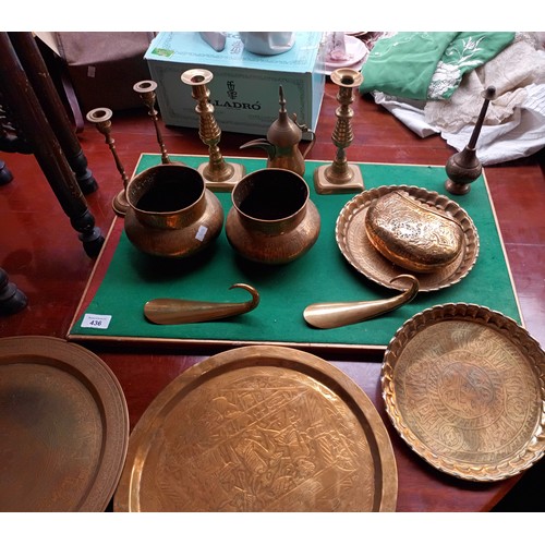 436 - Large collection of brass ware to include chargers, candlesticks, urns & Indian brass top table