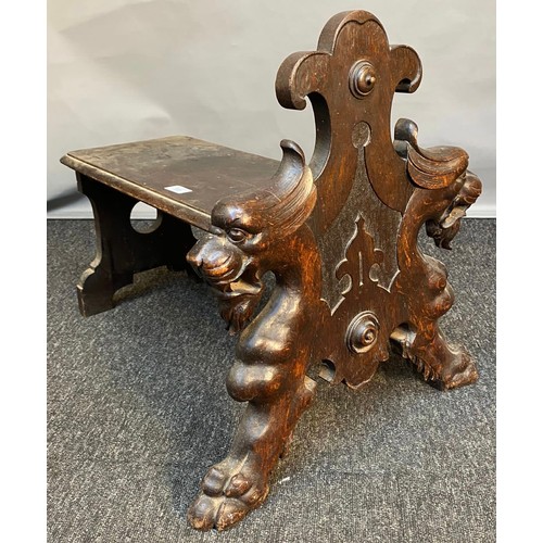 783 - 19th century small bench/ foot stool. Designed with carved front facing panel depicting lion style h... 