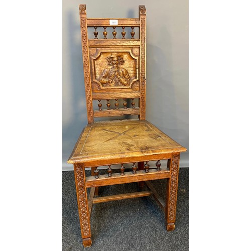 781 - 19th century oak carved chair, panel depicting raised relief carved man figure. [Signs of old woodwo... 