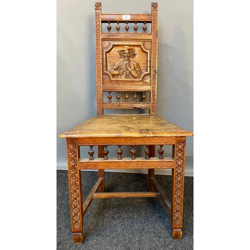 781 - 19th century oak carved chair, panel depicting raised relief carved man figure. [Signs of old woodwo... 