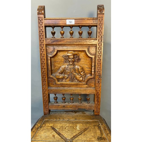 781 - 19th century oak carved chair, panel depicting raised relief carved man figure. [Signs of old woodwo... 