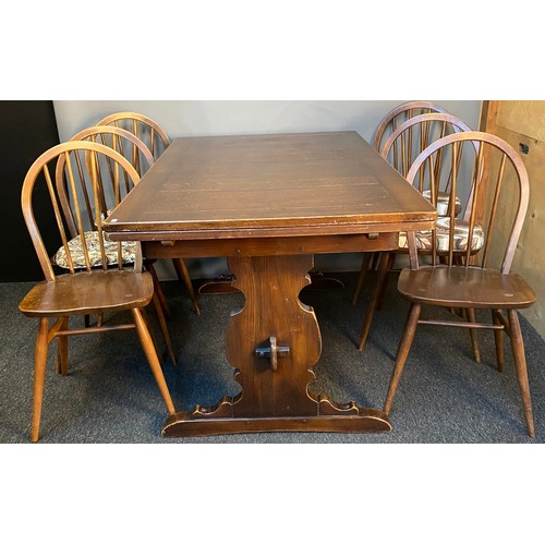 775 - Vintage Ercol dark wood extending dining table with 6 matching Ercol spindle back dining chairs. [Ta... 