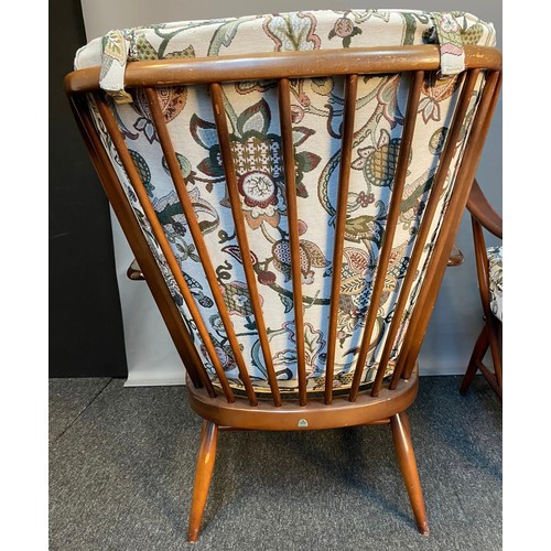 771 - Vintage 'His and Her' Ercol armchairs with original cushions.