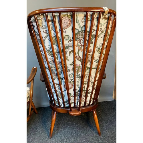 771 - Vintage 'His and Her' Ercol armchairs with original cushions.