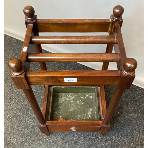 762 - 20th century Mahogany stick stand with single under drawer, original drip tray present. [62x34x27cm]