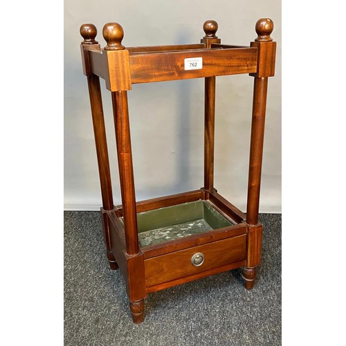 762 - 20th century Mahogany stick stand with single under drawer, original drip tray present. [62x34x27cm]