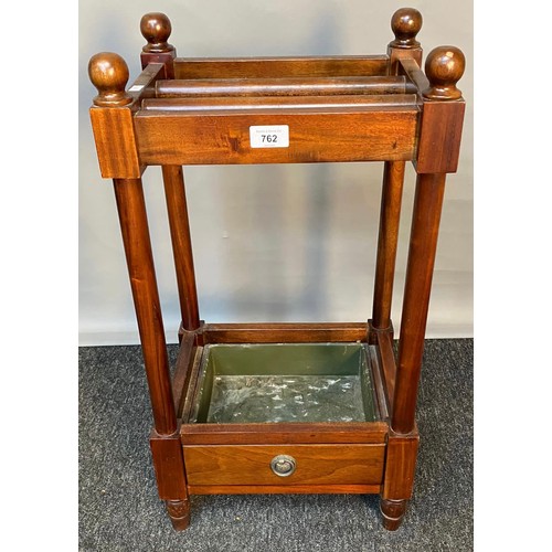 762 - 20th century Mahogany stick stand with single under drawer, original drip tray present. [62x34x27cm]