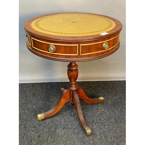 750 - 20th century barrel top table, the leather top raised on a tripod base ending in brass claw feet. [6... 