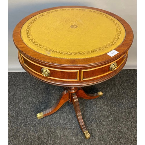 750 - 20th century barrel top table, the leather top raised on a tripod base ending in brass claw feet. [6... 