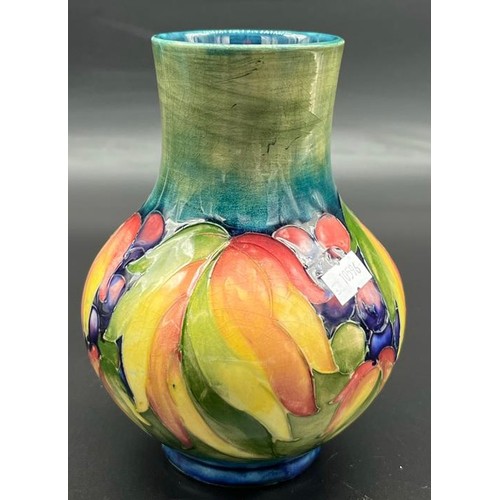 572 - William Moorcroft leaf and berry design Baluster vase. [Small chip to rim] [Impressed factory and H.... 