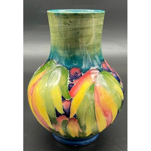 572 - William Moorcroft leaf and berry design Baluster vase. [Small chip to rim] [Impressed factory and H.... 